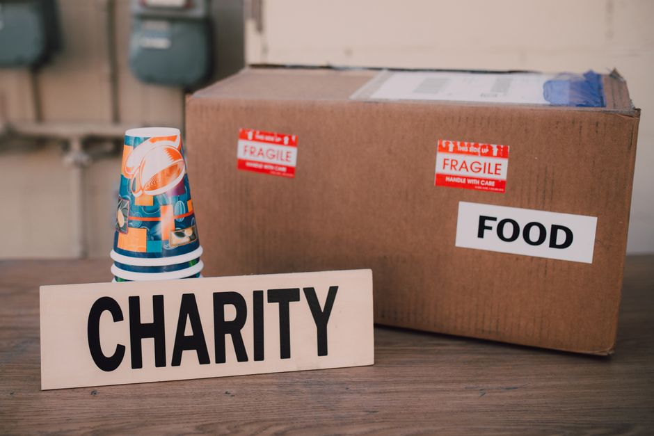 A charity donation box with supplies, representing community support.